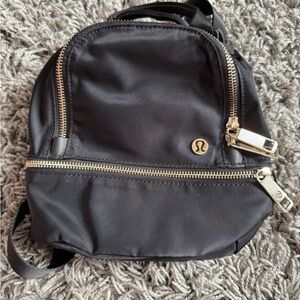 Lululemon Athletica Sleek Black Backpack with Gold Accents